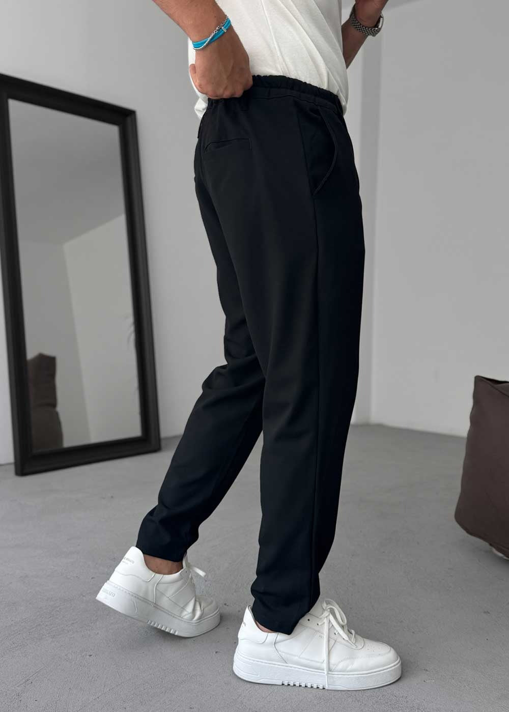 Pantalón de tela de corte relajado con cintura elástica – Negro
