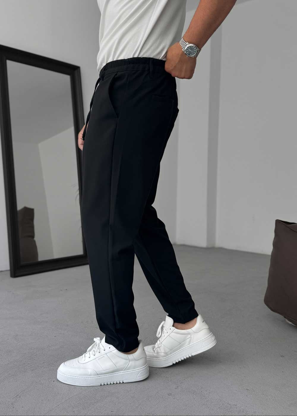 Pantalón de tela de corte relajado con cintura elástica – Negro